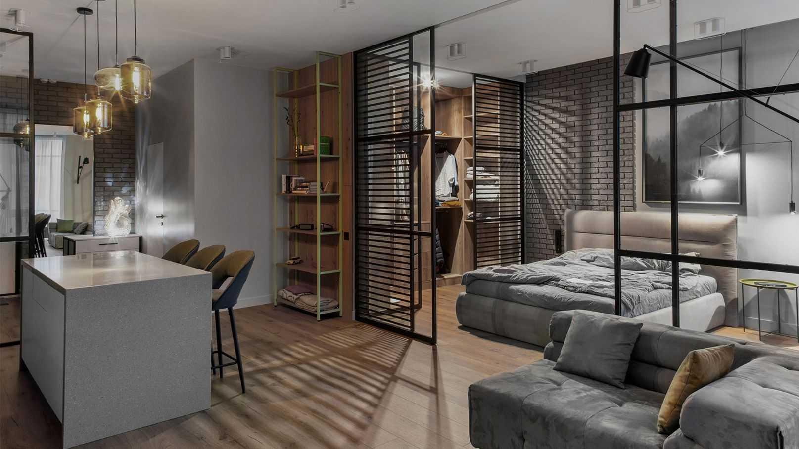 Mẫu decor phòng trọ cá tính sử dụng kệ sắt sơn tĩnh điện làm vách ngăn mở giữa giường và bếp (Nguồn: Internet).