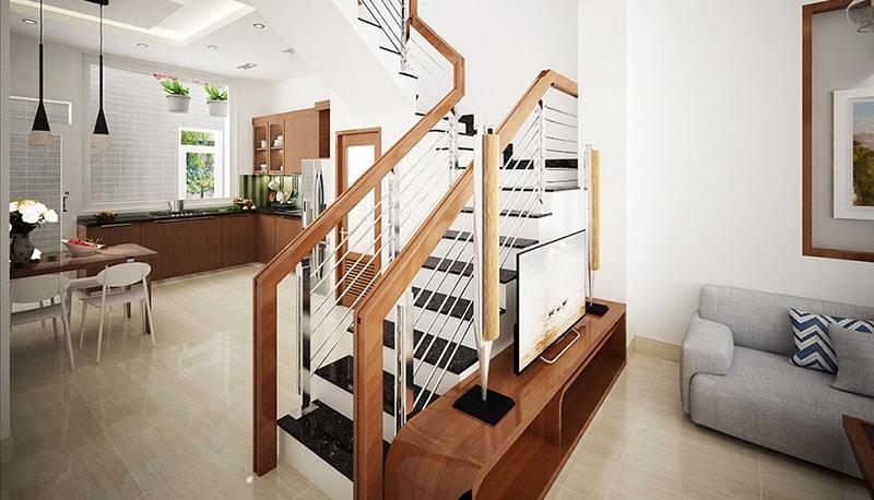 Thiết kế cầu thang chữ U nhỏ gọn, kết hợp làm vách ngăn không gian phòng khách và bếp (Nguồn: Internet)