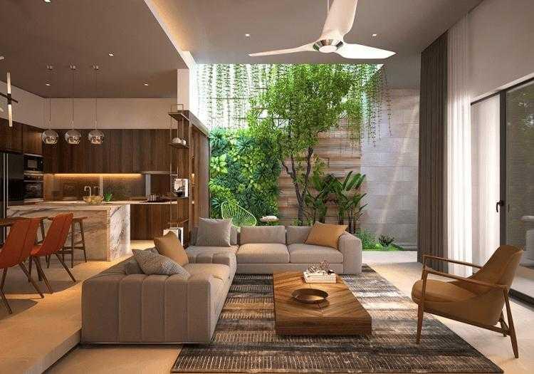 Không gian phòng khách trở nên sáng thoáng hơn nhờ ô lấy sáng và khu vườn nhỏ trong nhà